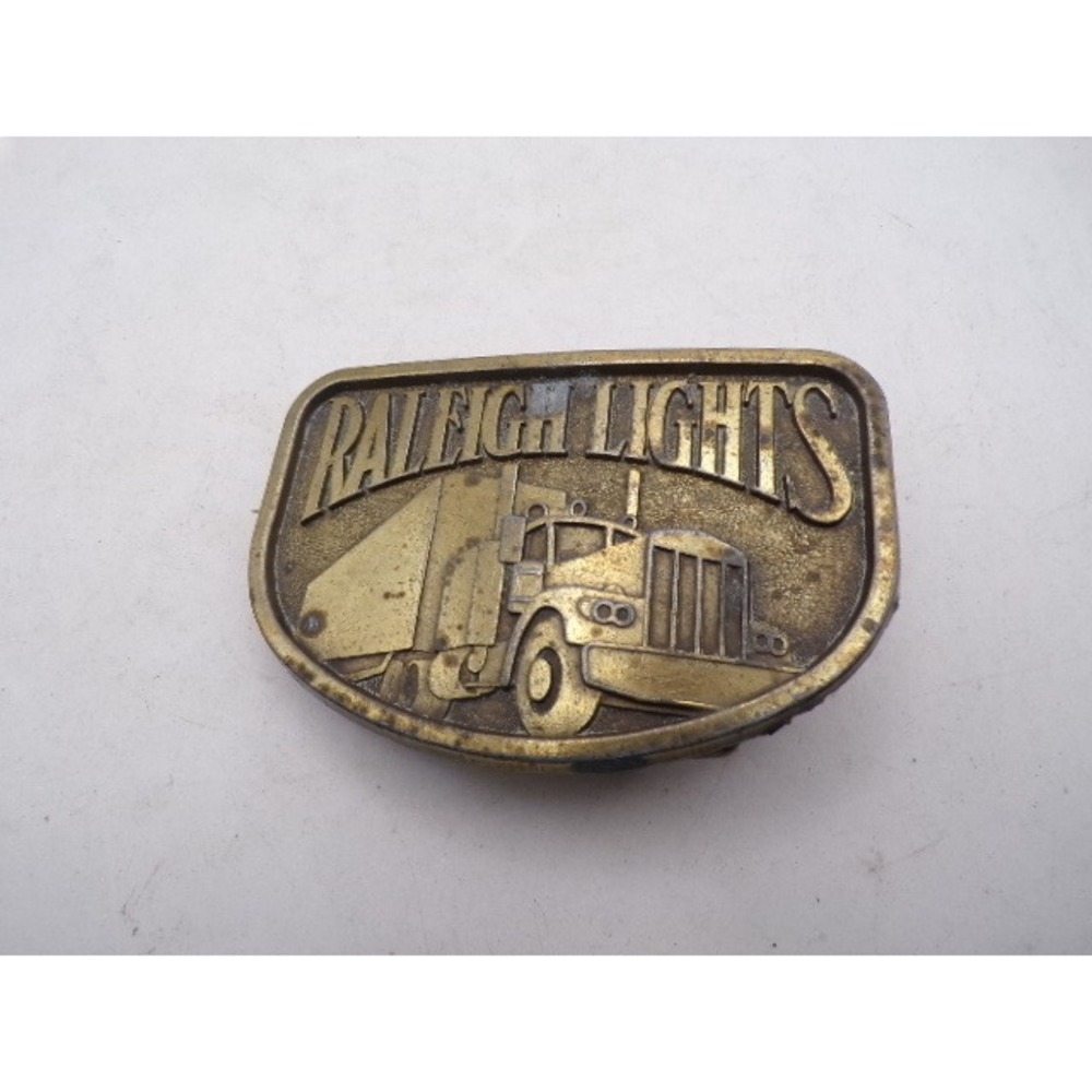 Vintage Raleigh Lights Brass Belt Buckle Semi Truck 18 Wheeler Tobacco Promo